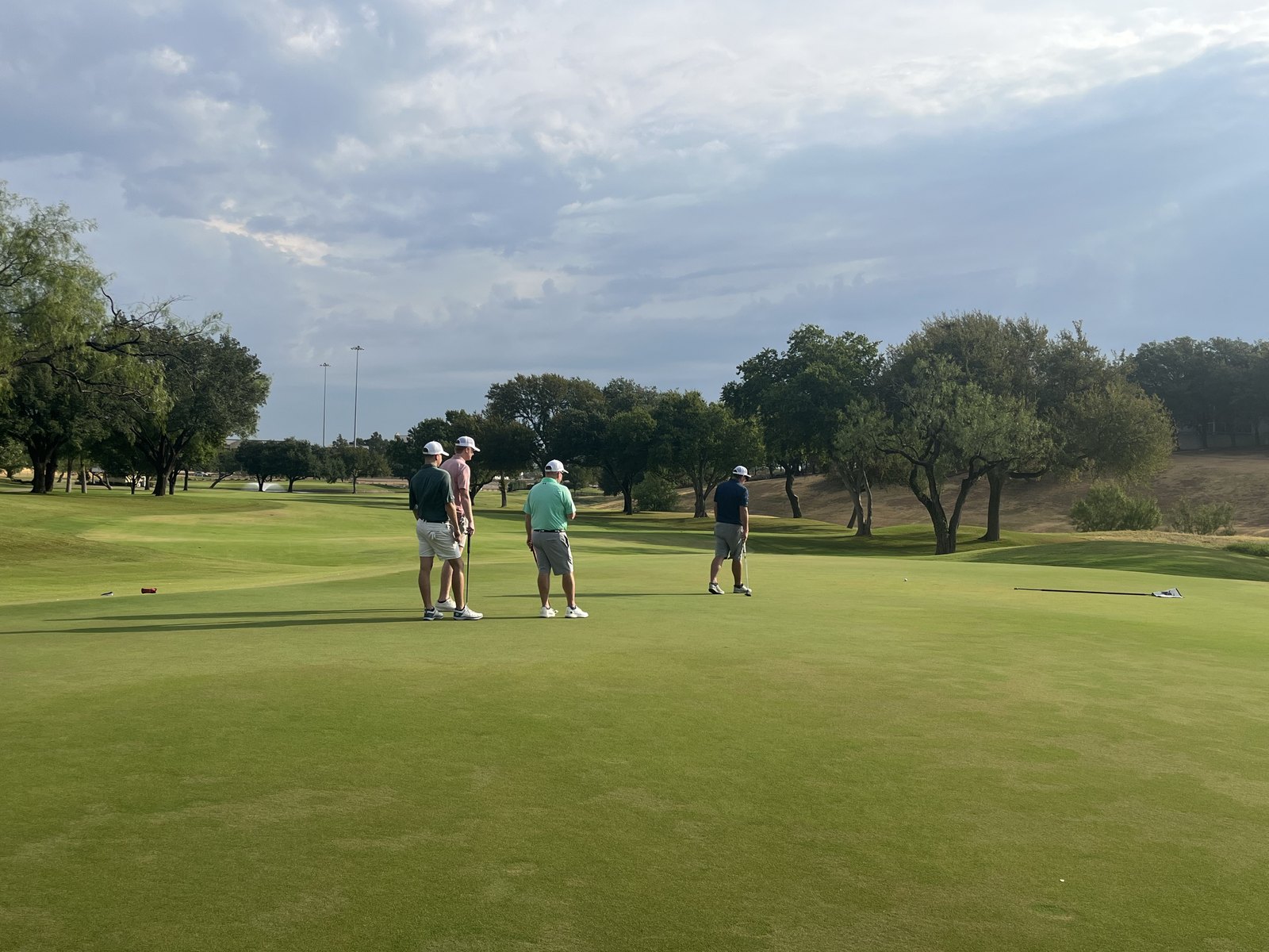 A foursome on the green at the VOA Texas DFW tournament